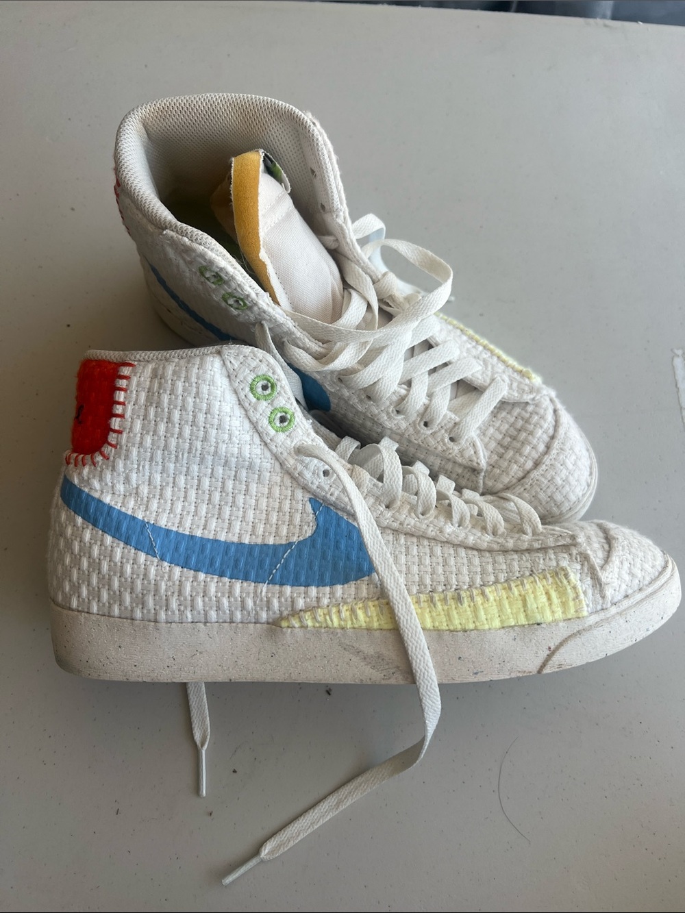 Women’s White High-Top Sneakers with Blue Swoosh and Yellow Accent